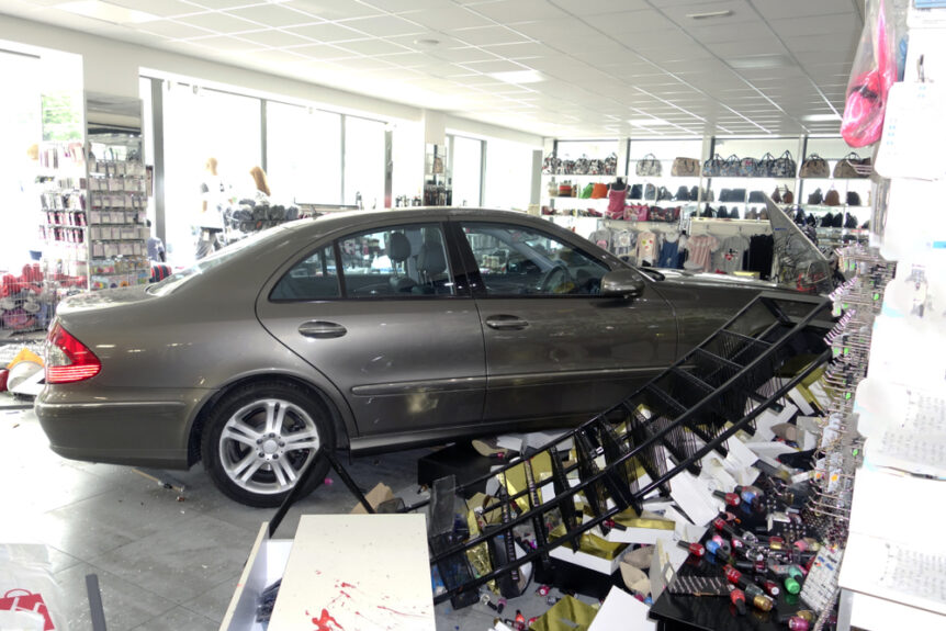 vehicle crashed into building causing damage to store and merchandise