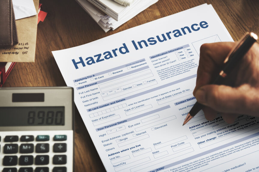person filling out hazard insurance form